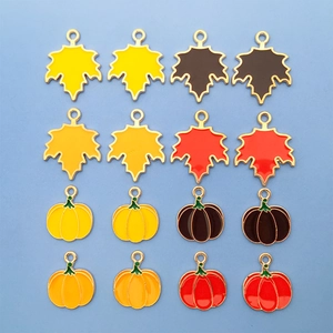 Autumn enamel maple leaf and pumpkin metal pendants in diverse fall colors set
