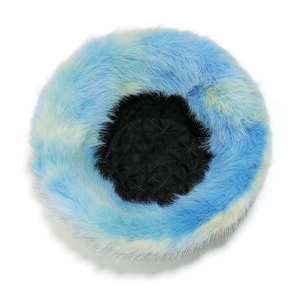 Detail view of the black quilted lining and tie-dye faux fur of the bucket hat