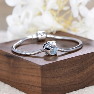 S925 sterling silver ocean dolphin charm on snake chain bracelet with blue glitter detail