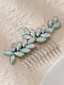 Detail of bridal hair comb with iridescent marquise-cut rhinestones and silver-tone prongs