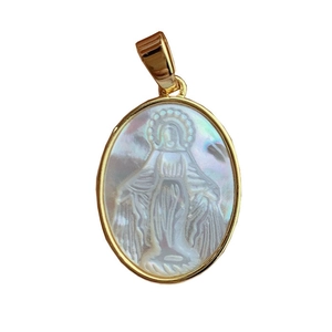 Gold pendant with oval white mother of pearl featuring a Virgin Mary relief carving