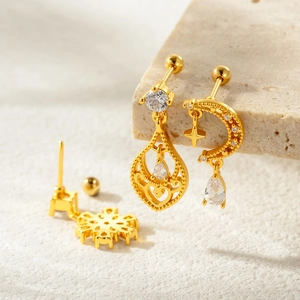 French vintage gold flower stud earrings with CZ inlay on a textured stone base
