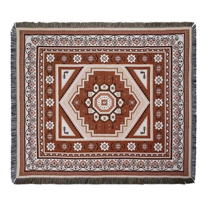 Ethnic geometric pattern woven blanket with bohemian tribal motifs and fringe edges