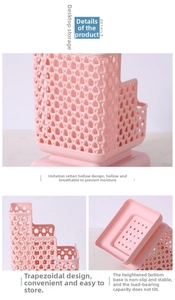 Detail view of pink rattan-style hollow plastic desk organizer with three tiers