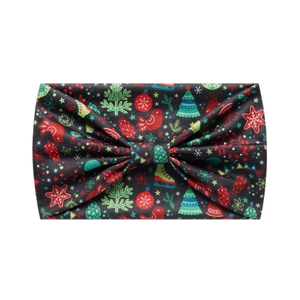 Close-up of fabric headband featuring festive Christmas tree and snowflake patterns