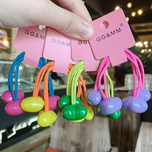 Detail of colorful candy-colored heart elastic hair ties on a pink packaging card