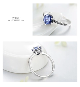 Detail of S925 sterling silver ring with crown-set blue zircon and intricate micro-pavé