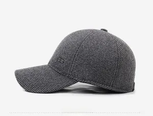 Side view of men's dark grey winter baseball cap with twill texture and metal logo detail