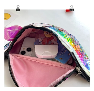 Close-up of sparkling sequin kids waist bag showing pink lining and internal storage