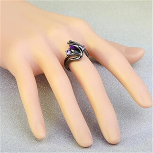 Detailed view of gunmetal black ring with marquise purple and black zircon stones