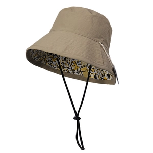 Waterproof khaki nylon bucket hat for women with reversible abstract graffiti pattern