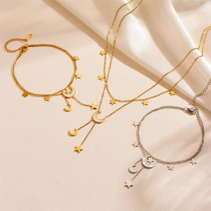 Elegantes Schmuckset in Gold und Silber mit Stern-Mond-Anhängern und Perlmutt-Inlay