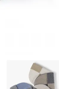 Detail showing high-quality two-tone wool knit texture and warm thick stitching of the beanie