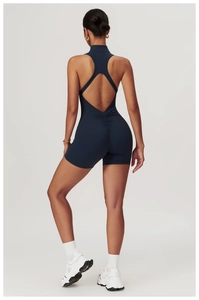 Detail of navy blue athletic bodysuit featuring scrunch butt and racerback design