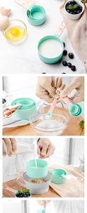 Detail of mint green measuring cups with rose gold handles and engraved capacity markings
