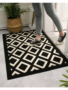 Detail of geometric diamond pattern entryway mat with non-slip texture and water absorption