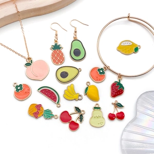 Detailed view of colorful fruit-themed enamel alloy pendants for DIY jewelry crafting