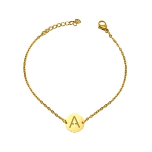 Minimalist gold titanium steel bracelet featuring a round pendant with engraved letter A