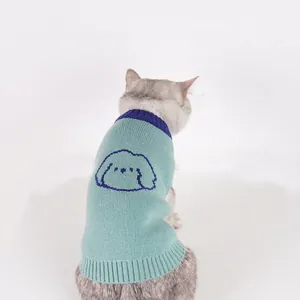 Knitted green pet sweater with contrast blue collar and cartoon dog pattern for cats and dogs