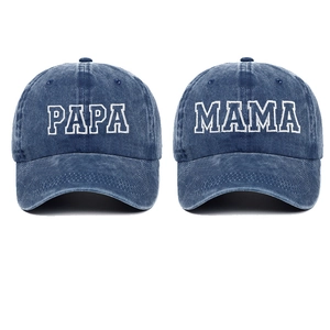 Detail of embroidered PAPA and MAMA text on washed navy blue denim baseball caps set