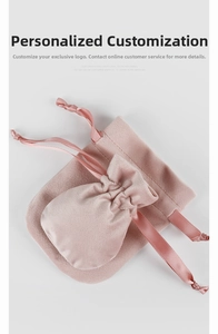 Macro view of pink velvet drawstring jewelry pouches in large and small sizes
