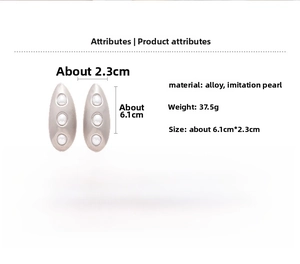 Detailed view of silver oval earrings with dimensions of 6.1cm by 2.3cm and pearl inlay