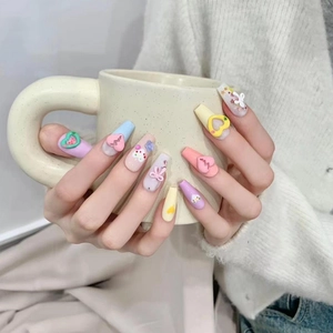 Handmade 3D heart press-on nails in pastel colors featuring cute bow and fruit designs