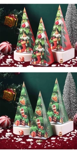Detail of cone-shaped Christmas candy boxes in red and green with festive holiday prints
