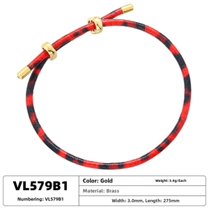 Detail of red and black leopard print cord bracelet with adjustable gold brass slider
