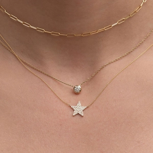 Three-layer gold-plated necklace featuring paperclip chain, solitaire zircon, and star pendant