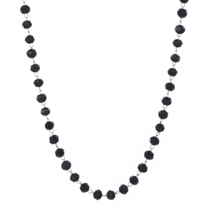 Detail of gothic beaded necklace featuring faceted black beads and gold metal links