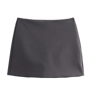 Flat lay of a minimalist dark gray mini skort in smooth premium woven fabric