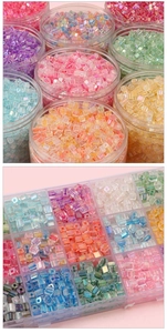 Detailed view of colorful 5mm iridescent glass cube beads in cylindrical storage jars