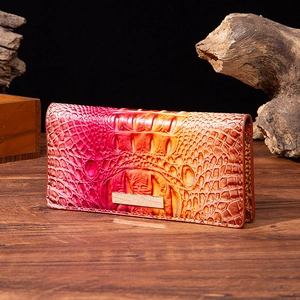 Deep-embossed crocodile texture wallet with metal detail in rose to orange gradient