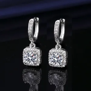 Elegant silver earrings featuring a 1-carat round cubic zirconia drop and polished metal