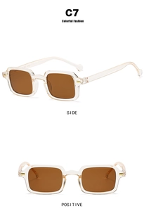 Detail view of square transparent resin sunglasses with brown lenses and golden accents