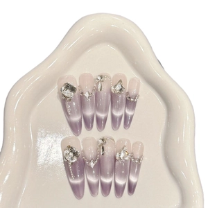 Purple cat eye press-on nails with luxury crystal rhinestones and metal chain charms