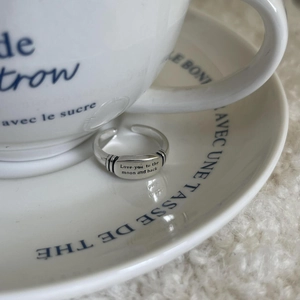 Detailed view of vintage silver ring with Love you to the moon and back engraving