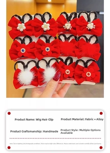 Detail of red velvet bow hair clips with faux pearls and braided hair extensions