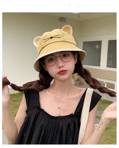Detail of yellow cat ear bucket hat featuring 3D ears and cute whisker embroidery
