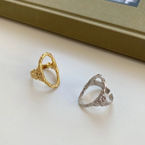 Detail of irregular lava texture and hollow oval design on S925 sterling silver rings