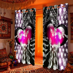 Detail of velvet curtains featuring purple hearts and butterfly patterns with metal eyelets