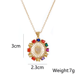 Detailed view of 18K gold heart pendant with colorful gems, 3cm height, 7g weight