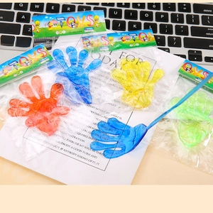 Detailed close-up of colorful sticky hand toys in individual transparent packaging
