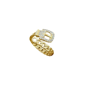Adjustable gold belt buckle ring with sparkling white zircons on a white background