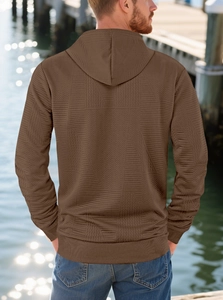 Back view of brown long-sleeve hoodie featuring premium herringbone textured fabric