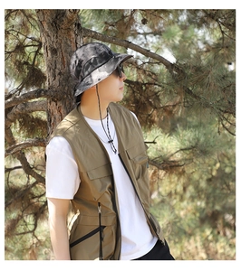 Detail of gray camouflage sun hat with breathable side mesh and adjustable wind cord