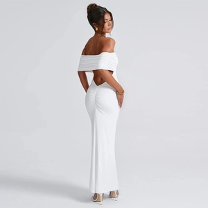 Detail of white backless dress featuring pleated texture and elegant floor-length hemline