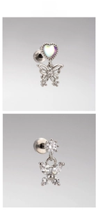 Detailed macro view of titanium butterfly stud earrings with opal hearts and zircons