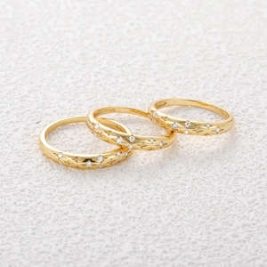 Detailed view of S925 sterling silver hallmarked inner band on star-studded gold ring